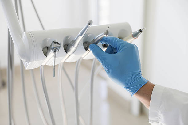 Professional Tooth Extraction technician working in St. Charles, MO